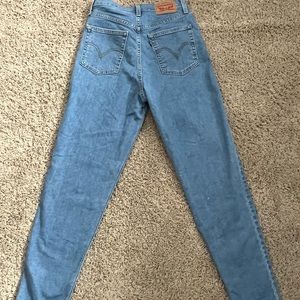 Levi’s high waisted taper jeans in medium wash